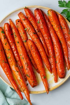 carrots on a white plate with parsley