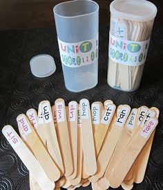 wooden utensils and cups on a table with labels for different types of utensils