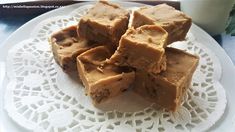 several pieces of brownie sitting on top of a white plate