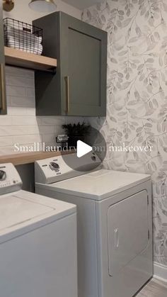 a washer and dryer in a small laundry room with floral wallpaper on the walls