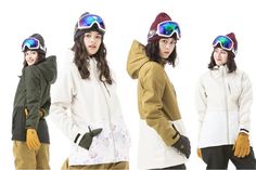 three women wearing snow gear and ski goggles