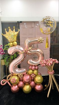 the number 25 is made out of balloons