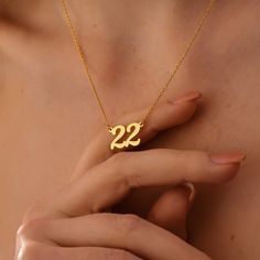 Rock your lucky number (or a special date!) with our Personalized Number  Necklace. This necklace features a delicate chain with a pendant you can  customize with any number or date that holds a special meaning for you.  Maybe it's your lucky number, your graduation year, or an anniversary you  cherish. This versatile necklace lets you wear your reminder close to your  heart, adding a touch of personalization to any outfit.  Super Features: * Your Number, Your Story: Personalize it with any numb Number 30 Necklace, Number Jewelry, Customized Necklace, Number Gifts, Angel Pendant Necklace, Graduation Year, Number Necklace, Silver Numbers, Angel Pendant