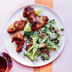 a white plate topped with chicken and broccoli