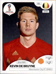 the soccer player is wearing a red shirt and has his head tilted to the side