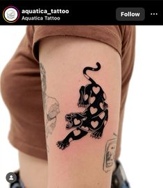 a woman's arm with a tattoo on it that has a dog in the shape of a heart