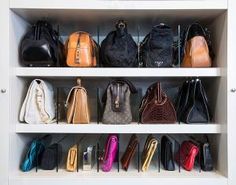 the purses are lined up on the shelves