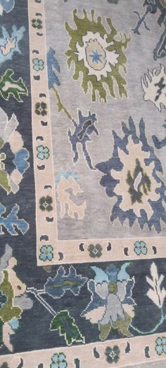 two rugs with different designs on them, one is blue and the other is green