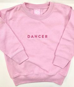 Have your little one show off their passion for dance with this sturdy and warm sweatshirt anytime they're not at the dance studio. Great for looking adorable during dance class too! 60% cotton, 40% polyester Coverstitched collar Ribbed cuffs and waistband Dance Studio Merch, Cute Dance Outfits, Hoodie Wishlist, Dance Shirts Ideas, Dance Sweatshirt, Dance Things, Balloon Cars, Toddler Dance, Dance Comp