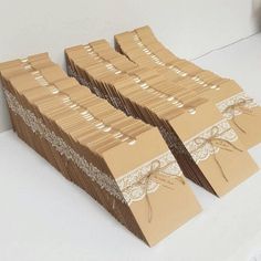 there are many brown boxes with lace on them