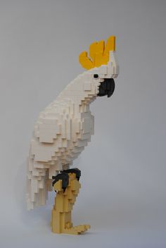 a white and yellow bird made out of legos