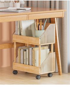 a wooden desk with books and office supplies on it, next to a book shelf