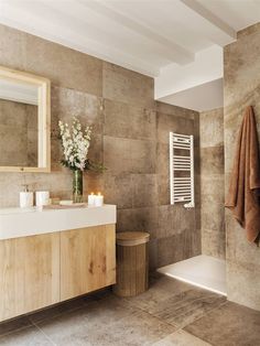 a bathroom with a sink, toilet and bathtub next to a wall mounted towel rack