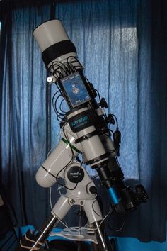 a large telescope sitting on top of a table