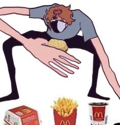 a man is sitting on the ground with his legs spread out as he eats french fries