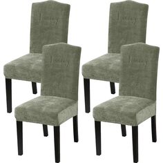 pair of green velvet dining chairs with black legs