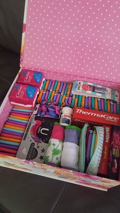 a pink box filled with lots of different items