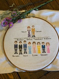 a cross stitch pattern with people on it and flowers in the corner next to it