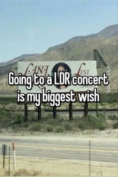 a sign with the words going to a lr concert is my biggest wish on it