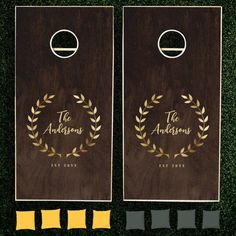 two brown and gold cornhole game boards with the words, the andrewss on them