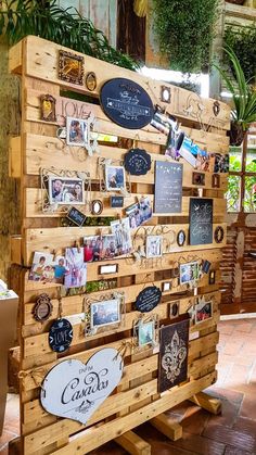 a wooden display with many pictures on it