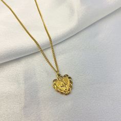 Embrace the beauty of faith and love with our Embroidered Heart Cross Necklace. This elegant piece showcases a beautifully embroidered cross nestled within a heart-shaped pendant, creating a heartfelt symbol of devotion and spirituality. With its intricate detailing and timeless design, it's the perfect accessory. Latina Culture, Heart Cross Necklace, Embroidered Cross, Cross Heart, Golden Heart, Gold Cross Necklace, Embroidered Heart, Wood Crosses, Gold Cross