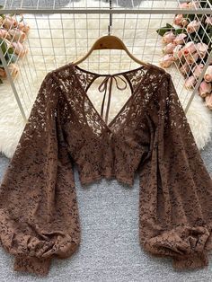 Upgrade your summer wardrobe with our Women Black/White/Brown Sexy Lace Blouse. The elegant and stylish design features a delicate lace pattern that adds a touch of glamour to any outfit. The comfortable and breathable fabric ensures you stay cool and confident all day long. The versatile color options make it perfect for any occasion, whether it's a night out or a day at the office. Available in a range of sizes to suit any style. Order now and make sure you have this must-have addition to your Women Lace Blouse, Mode Hippie, Lace Blouse Long Sleeve, Earthy Outfits, Estilo Hippie, Sheer Lace Top, Puff Long Sleeves, Mode Inspiration, Looks Vintage