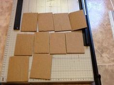 several pieces of cardboard sitting on top of a cutting board