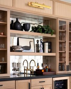 a kitchen filled with lots of wooden cabinets and counter top space next to an oven