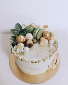 a white cake topped with lots of different types of candies