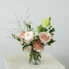 a vase filled with flowers on top of a table