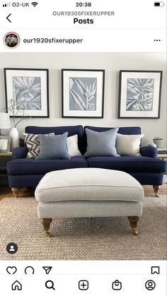 a couch and ottoman in a living room with pictures on the wall above it, along with other furniture