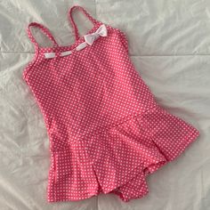 Lands’ End Skirted One-Piece Swimsuit. Pink With White Polka Dots & Ribbon Detail At Neckline. Adjustable Cross-Back Spaghetti Straps. Attached Pleated Style Skirt. Nylon/Spandex Blend. Never Worn. Nwot Skirt Bathing Suit Two Piece, One Piece Swimsuit Skirt, Fitted Summer Swimwear For Playtime, Fitted Swimwear For Summer Playtime, Fitted White Swimwear For Playtime, Fitted Cotton Playful Swimwear, Playful Fitted Cotton Swimwear, Pink Cotton Swimwear For The Pool, Swimsuit Skirt