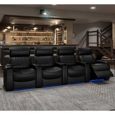 a home theater with black leather seats