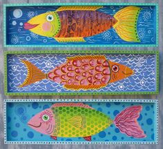 three trays with fish painted on them