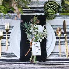 an instagram page with flowers and silverware on it, including a place setting