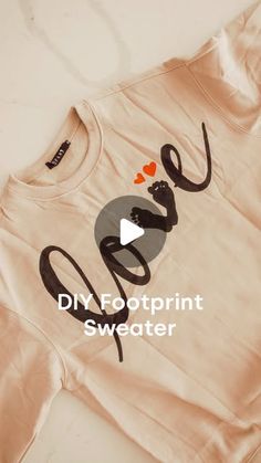 a t - shirt with the words diy footprint sweater on it