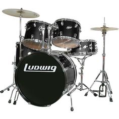 a black drum set with white lettering on it