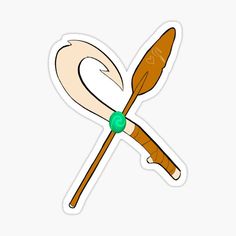 two crossed wooden spoons with green bead sticker