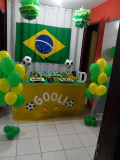 a room decorated with balloons and soccer balls