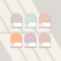 six shades of pastel paint with the names of each color in different sizes and shapes