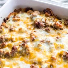 a casserole dish filled with meat and cheese