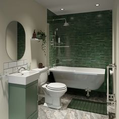 a white toilet sitting next to a bath tub in a bathroom under a round mirror