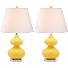 two yellow lamps sitting next to each other