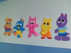 there are five cut outs of cartoon characters on the wall