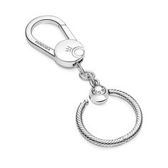 Personalize your bag with the Pandora Moments Small Bag Charm Holder. Hand-finished in sterling silver, this bag charm holder features a small lobster clasp and jump rings with Pandora's iconic snake chain pattern. The charm holder can hold a maximum of three charms, dangles or pendants. Accessorize your look and elevate your bag with a stylish charm holder made to carry the charms that speak to you and show off who you are. Charms Disney, Pandora Essence, Bracelet Tennis, Bracelet Pandora, Charm Holder, Chain Pattern, 925 Silver Bracelet, Bracelet Diy, Casual Sporty