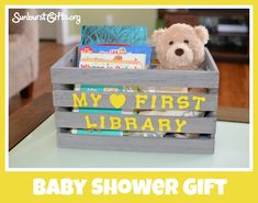 a baby shower gift box with a teddy bear in it and the words, my first library