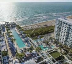 an aerial view of the beach and pool area at ocean club in destinia, florida