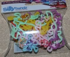 a package of sillybandz bracelets on the ground