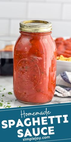 homemade spaghetti sauce in a mason jar on a counter with the words homemade spaghetti sauce